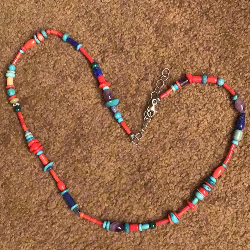Turquoise, coral and other gems in unique necklace